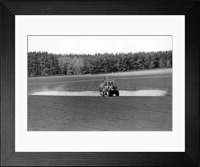 Framed Print : The giant 80 ft. booms of this MB-Trac-mounted sparyer allows the farmer to spray huge Framed Print : The giant 80 ft. booms of this MB-Trac-mounted sparyer allows the farmer to spray huge