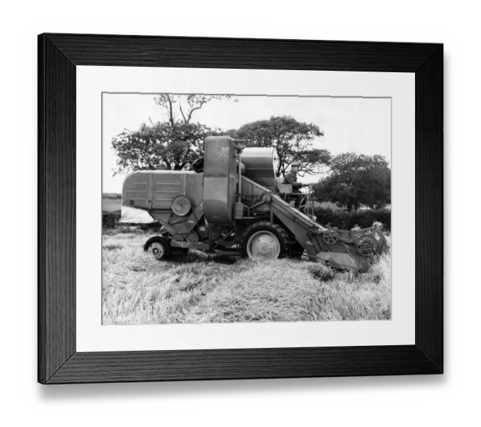 Framed Print : A very early combine harvester Circa 1960