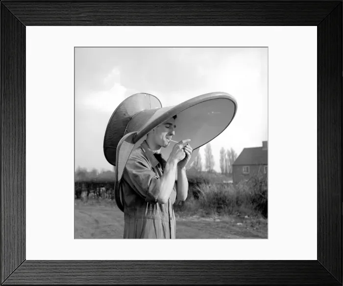 Framed Print : An alternative use for a hip bath. This workmen is using it as a hat