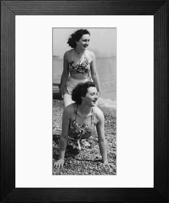 Framed Print : Holidaymakers play a wheelbarrow race on the pebble beach at Hastings May 1947 Framed Print : Holidaymakers play a wheelbarrow race on the pebble beach at Hastings May 1947
