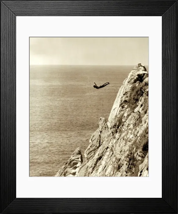 Framed Print : This scenic shot of rocky cliffs and the sea below is the setting for local divers - who Framed Print : This scenic shot of rocky cliffs and the sea below is the setting for local divers - who