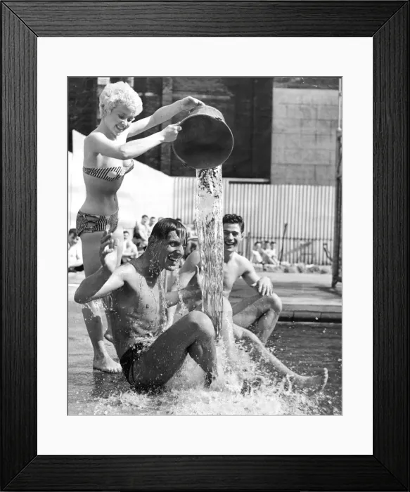 Framed Print : One way to cool off in the present heat wave is to have a bucket of cold water thrown Framed Print : One way to cool off in the present heat wave is to have a bucket of cold water thrown