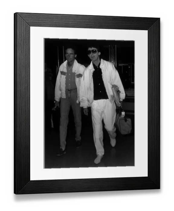 Framed Print : Former Beatles singer and guitarist George Harrison with Barry Sheene at London Airport Framed Print : Former Beatles singer and guitarist George Harrison with Barry Sheene at London Airport