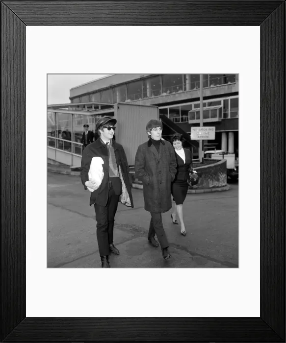 Framed Print : John Lennon and George Harrison of the Beatles pop group at the airport before leaving Framed Print : John Lennon and George Harrison of the Beatles pop group at the airport before leaving