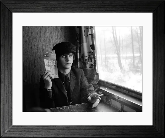 Framed Print : The Beatles February 1964 Ringo Starr holding Seaboard railroad card on the train