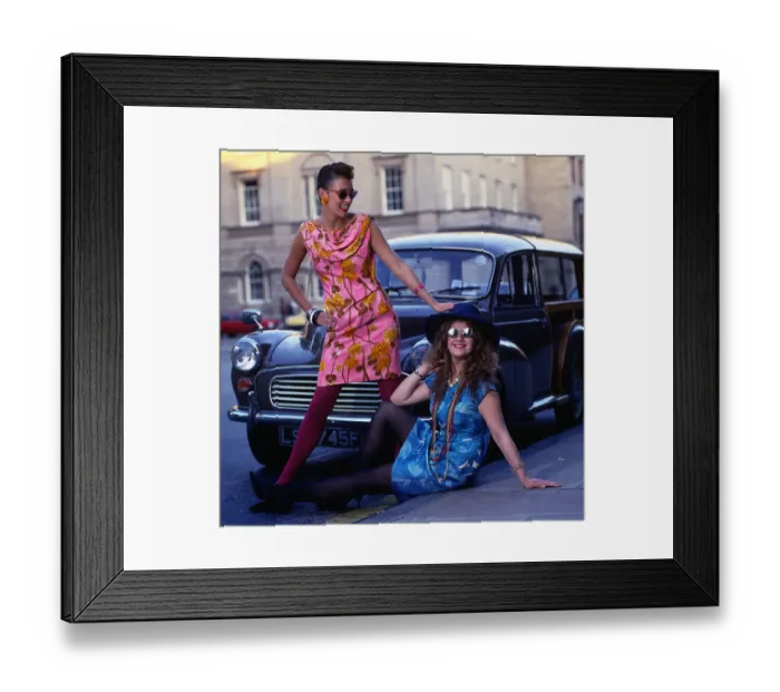 Framed Print : Mini Dress Fashion Two models wear floral print dresses in sixties style August Framed Print : Mini Dress Fashion Two models wear floral print dresses in sixties style August