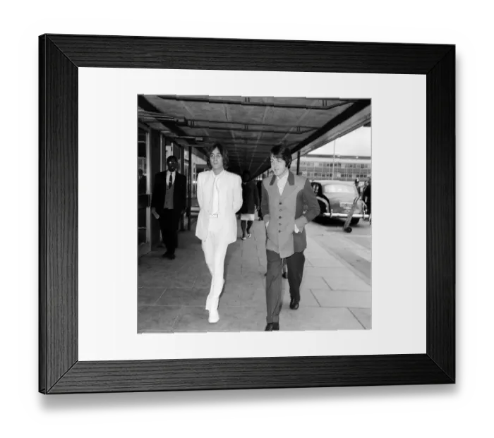 Framed Print : John Lennon and Paul McCartney fly from Heathrow Airport to New York to discuss
