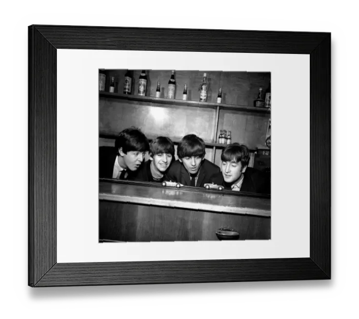 Framed Print : The Beatles in Coventry, amusing themselves with a miniture car race track before