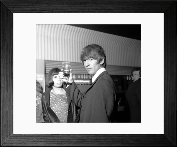 Framed Print : George Harrison raises his glass at the Prince of Wales Theatre, Leicester Square