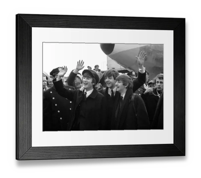 Framed Print : Beatles l-r: John Lennon, Paul McCartney and Ringo Starr wave to fans upon their arrival
