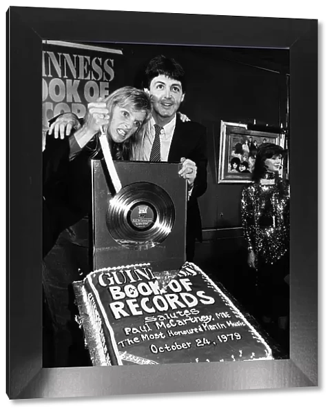 Paul McCartney former singer with The Beatles and wife Linda at the Guinness book of