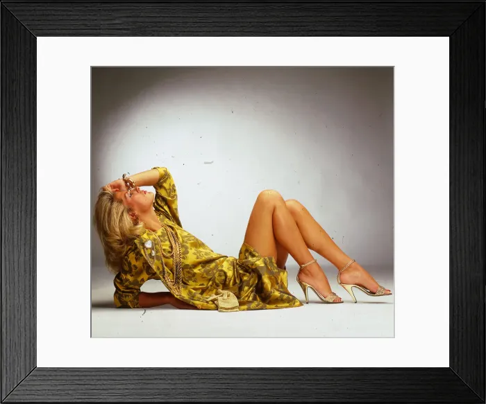 Framed Print : Fashion - yellow and gold female suits August 1988 Model wearing yellow