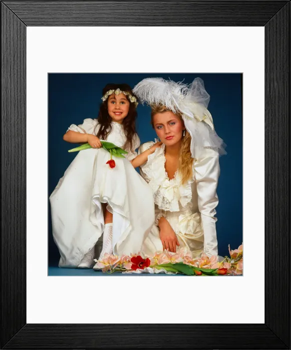 Framed Print : Wedding dress fashion, February 1987 model wearing wedding dress sitting ground