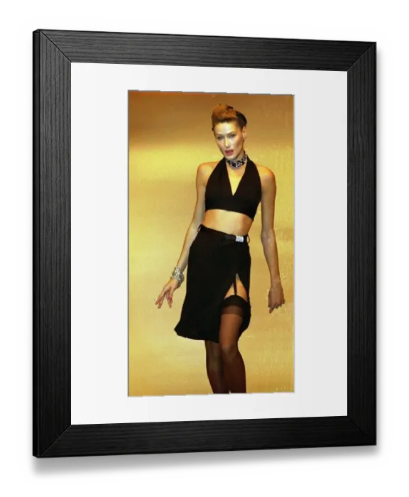 : Carla Bruni modelling a halter neck cropped top and skirt and showing stockings : Carla Bruni modelling a halter neck cropped top and skirt and showing stockings
