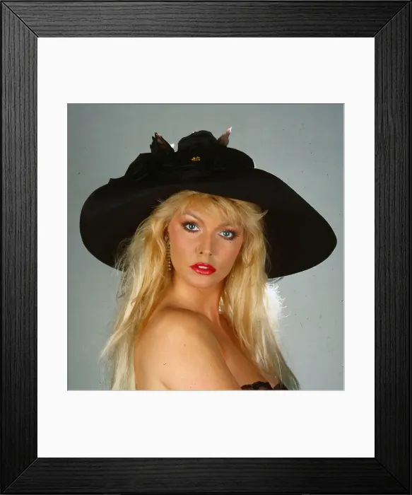 Framed Print : Hat fashion model wears black silk hat with roses April 1990