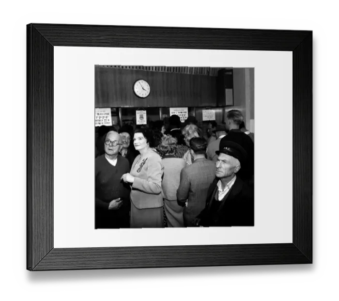 Framed Print : A busy scene inside a betting shop with punters queuing to make bets minutes before
