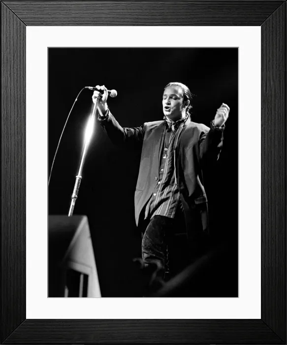 Framed Print : Rock group U2 in concert in USA - May 1987 Bono singing and playing guitar Framed Print : Rock group U2 in concert in USA - May 1987 Bono singing and playing guitar
