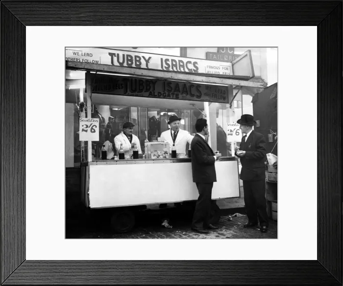 Framed Print : Tubby Isaacs behind the counter of one of his mobile stalls selling jellied eels while Framed Print : Tubby Isaacs behind the counter of one of his mobile stalls selling jellied eels while
