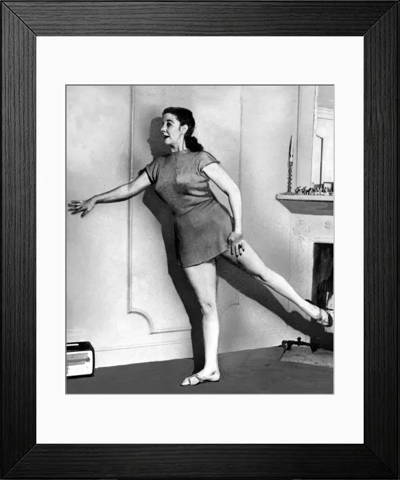 Framed Print : Womens Beauty Culture Kelly Bluett demonstrates leg exercises June 1949 Framed Print : Womens Beauty Culture Kelly Bluett demonstrates leg exercises June 1949