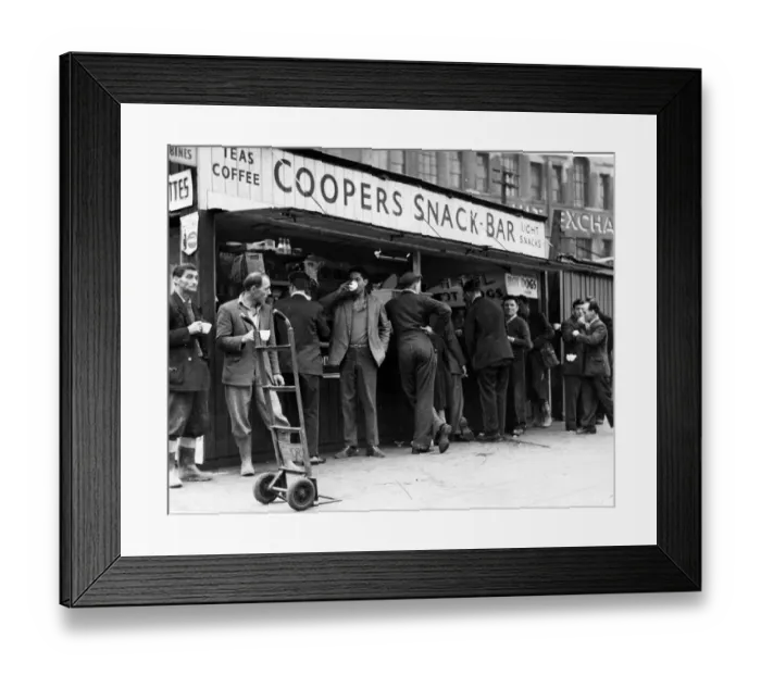 Framed Print : A cup of tea makes a welcome break for these men, many of whom have been working in