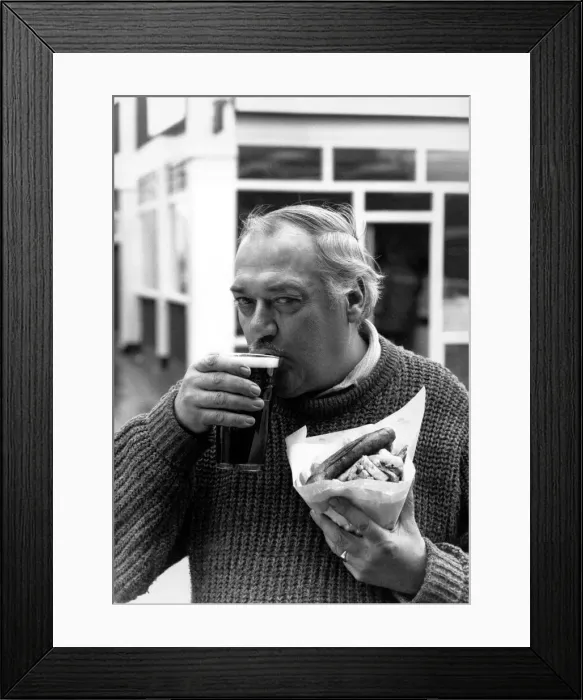 Framed Print : Nobby Clarke enjoys tucking into sausage and chips and a pint at his local The Railway Framed Print : Nobby Clarke enjoys tucking into sausage and chips and a pint at his local The Railway
