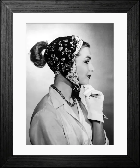 Framed Print : A woman modelling a scarf designed to be worn in five different ways Framed Print : A woman modelling a scarf designed to be worn in five different ways