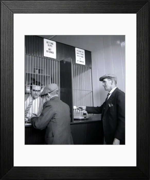 Framed Print : Punters placing their bets inside William Massie betting shop in Bethnal Green Framed Print : Punters placing their bets inside William Massie betting shop in Bethnal Green