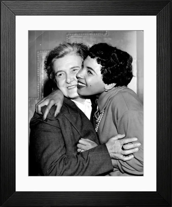 Framed Print : Welsh singing sensation Shirley Bassey from Cardiff gives her mother a hug - Feb 1957 Framed Print : Welsh singing sensation Shirley Bassey from Cardiff gives her mother a hug - Feb 1957