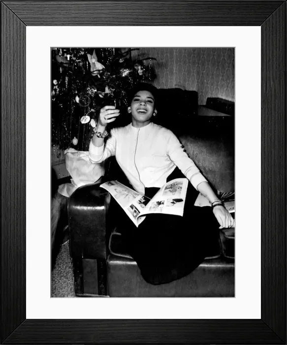 Framed Print : Shirley Bassey - The Welsh singer sensation salutes 1957 with her glass held high Framed Print : Shirley Bassey - The Welsh singer sensation salutes 1957 with her glass held high