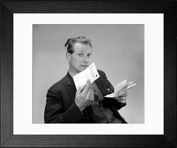 Framed Print : A punter holding his betting slips and a receipt March 1963 Framed Print : A punter holding his betting slips and a receipt March 1963