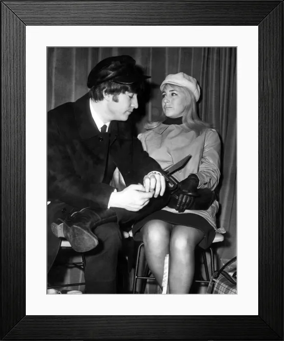 Framed Print : The Beatles - John Lennon pictured with his wife Cynthia in the lounge of London airport