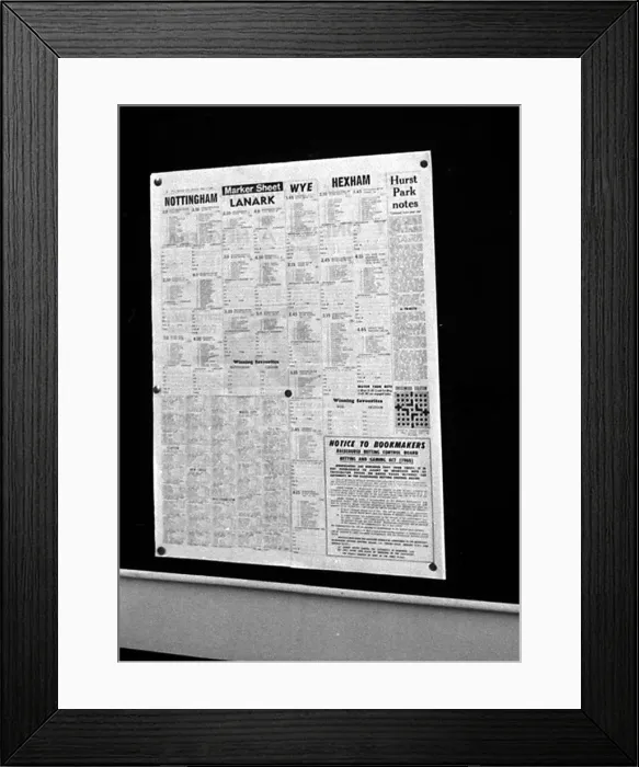 Framed Print : The form guide pinned to a notice board inside Peter Massie betting shop in Bethnal Green Framed Print : The form guide pinned to a notice board inside Peter Massie betting shop in Bethnal Green