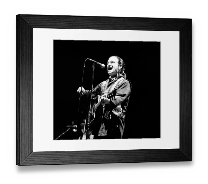 Framed Print : Rock group U2 in concert in USA - May 1987 Bono singing and playing guitar Framed Print : Rock group U2 in concert in USA - May 1987 Bono singing and playing guitar