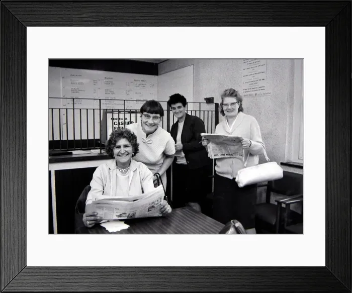 Framed Print : Four sporting ladies smiling after placing winning bets at a Ladies only betting shop in Framed Print : Four sporting ladies smiling after placing winning bets at a Ladies only betting shop in