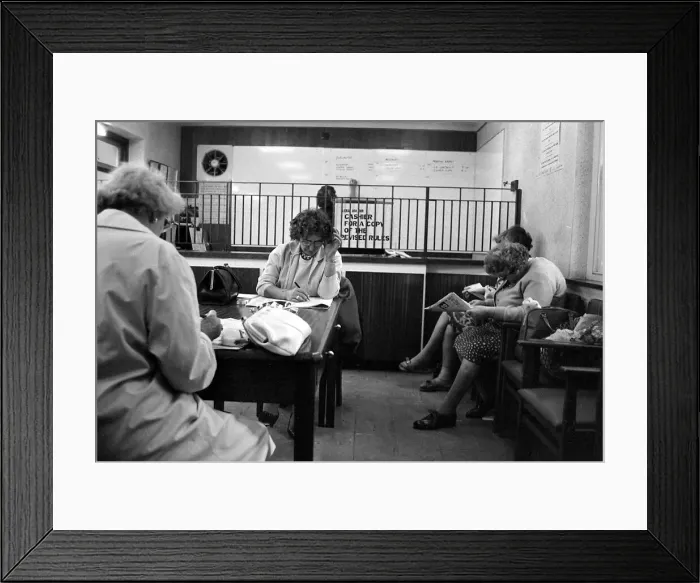 Framed Print : Four ladies studying the form guide before placing their bets at a Ladies only betting Framed Print : Four ladies studying the form guide before placing their bets at a Ladies only betting