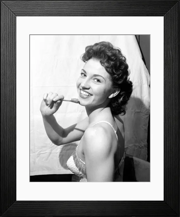 Framed Print : Shirley Dennis who hangs by her teeth twice nightly October 1957