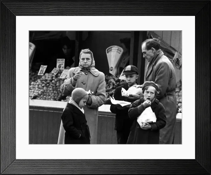 Framed Print : Lunchtime in Great Yarmouth and nearly all the local shoppers eat chips