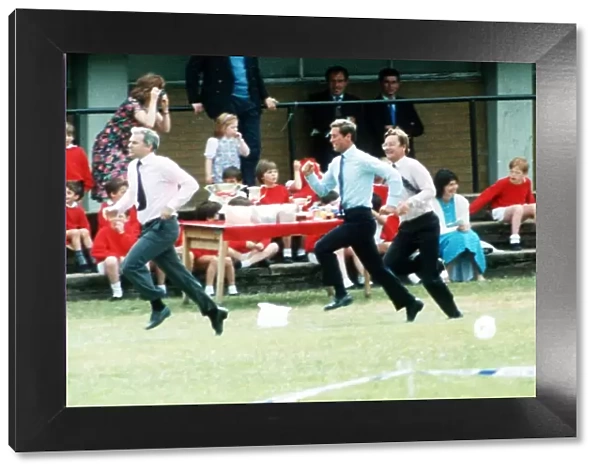 Prince Charles running in the Sports Day Dads Race at the school of Prince William