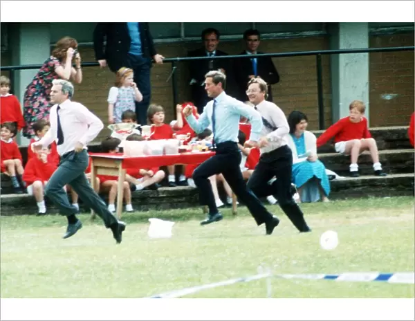 Prince Charles running in the Sports Day Dads Race at the school of Prince William