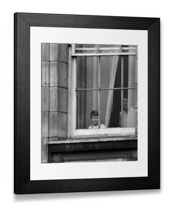 Framed Print : Prince Charles looks out of a window at Buckingham Palace to see the crowds Framed Print : Prince Charles looks out of a window at Buckingham Palace to see the crowds