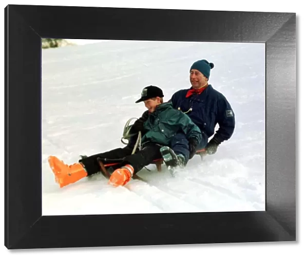 Prince Charles on a sledge with Prince Harry while on holiday in Klosters Switzerland