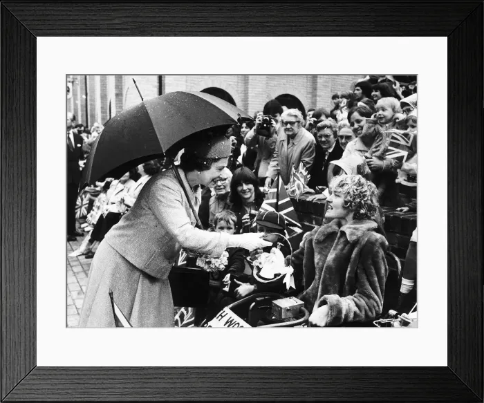 Framed Print : Queen Elizabeth II on a visit to Essex receives a model of Prince Charles