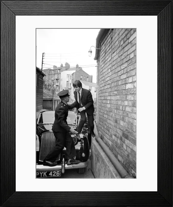 Framed Print : The Beatles August 1964 Paul McCartney is helped over his car by a guard to escape Framed Print : The Beatles August 1964 Paul McCartney is helped over his car by a guard to escape