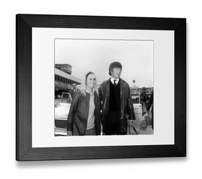 Framed Print : May 1964 John Lennon with his wife Cynthia walk to the car as they arrive back in England Framed Print : May 1964 John Lennon with his wife Cynthia walk to the car as they arrive back in England