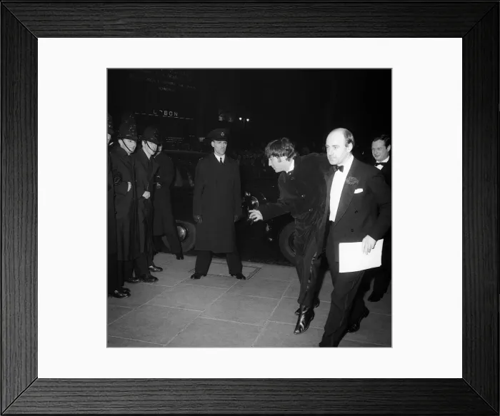 Framed Print : The Beatles March 1964 John Lennon makes some funny moves as the group arrive Framed Print : The Beatles March 1964 John Lennon makes some funny moves as the group arrive