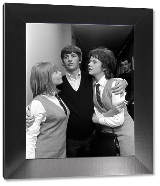 Beatles drummer Ringo Starr with two actresses at Twickenham film studios, February 1964