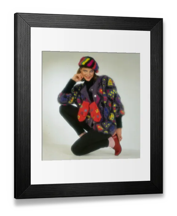 Framed Print : Woollens fashion, November 1985 Female modelling multi-coloured cardigan gloves Framed Print : Woollens fashion, November 1985 Female modelling multi-coloured cardigan gloves