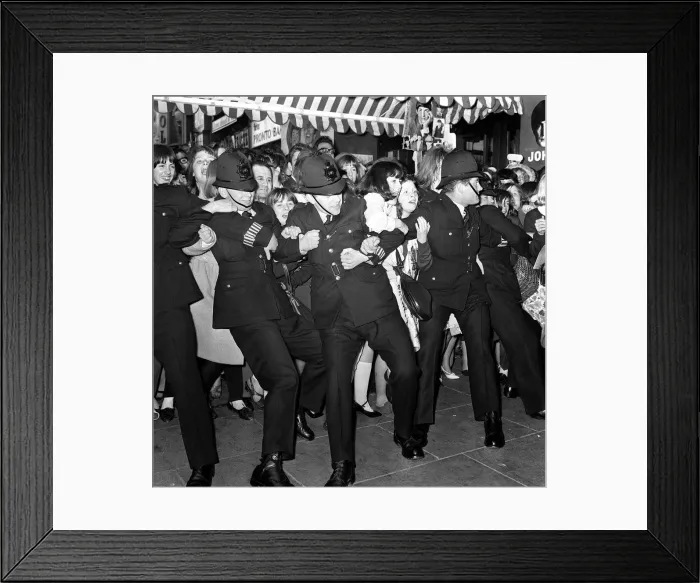 Framed Print : 10 July 1964 Police holding back crowds of fans, who are waiting to see The Beatles