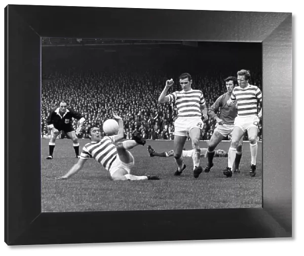 Celtic v. Rangers Bobby Murdoch clears for Celtic as Colin Stein lies injured in
