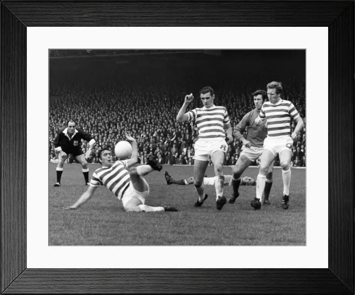 Framed Print : Celtic v. Rangers Bobby Murdoch clears for Celtic as Colin Stein lies injured in